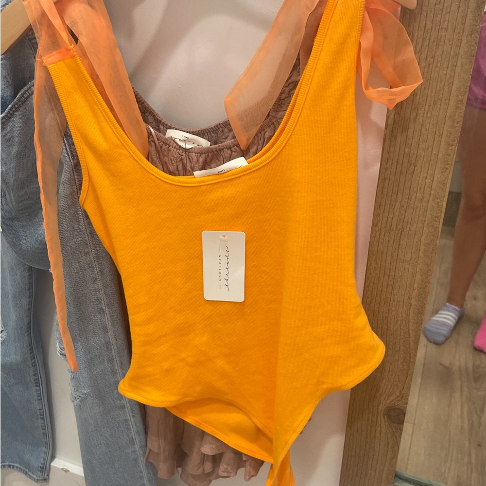 Orange bodysuits